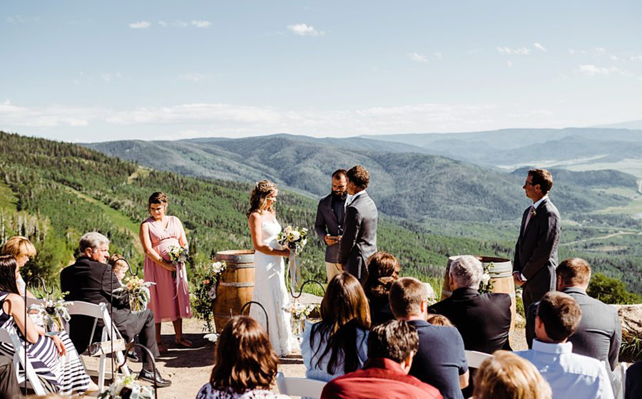 A bride and groom saying their vows overlooking the Yampa Valley